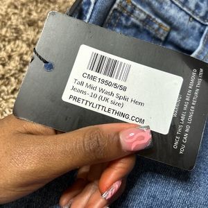 Mid wash split hem jeans from pretty little things.